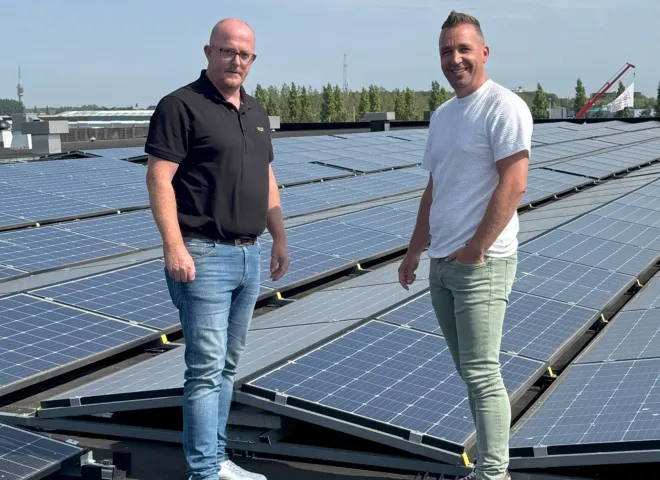Dutch Green Energy employees at solar panels